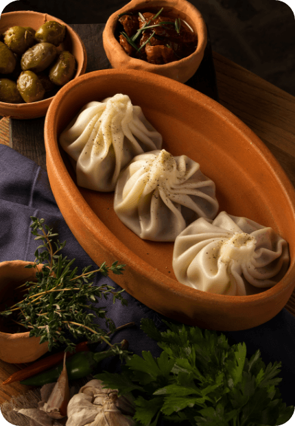 DUMPLINGS SAUCE (MOMO) being poured into a wooden bowl