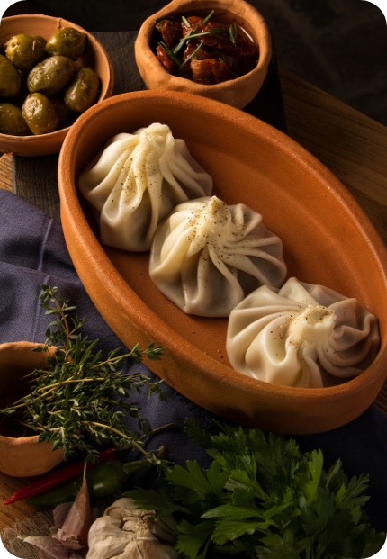 DUMPLINGS SAUCE (MOMO) being poured into a wooden bowl